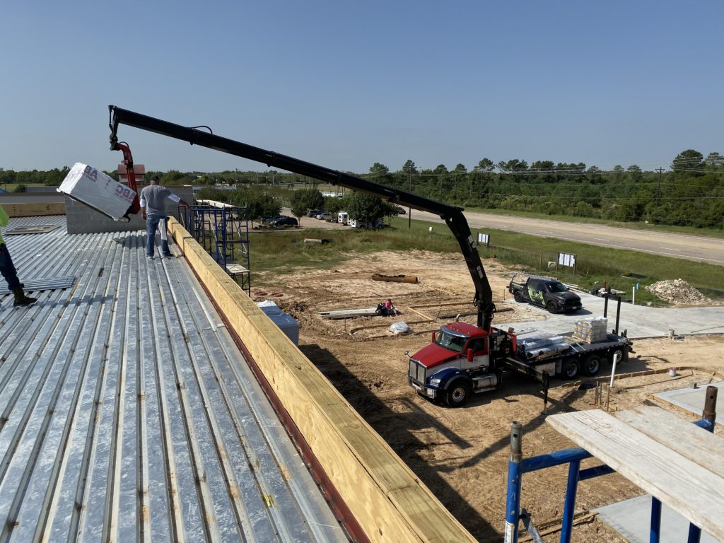 roofing contractors installing a commercial roof