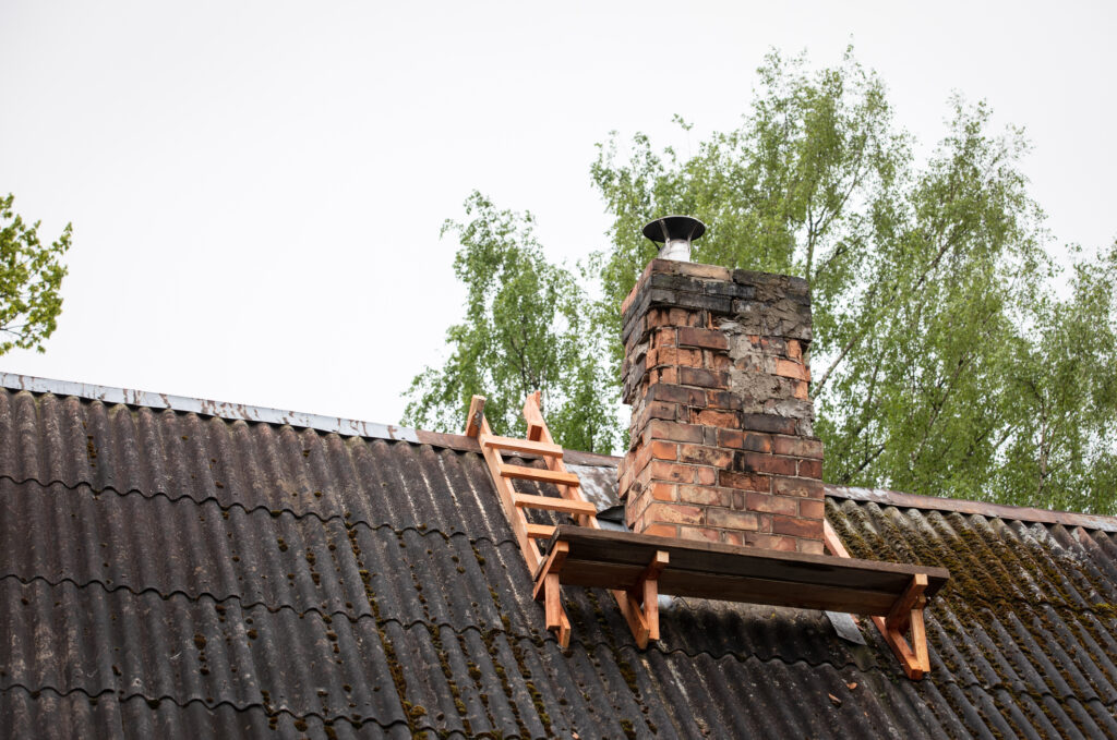 Structural damage to the chimney and surrounding areas